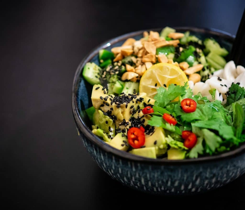 Healthy vegan food a person cutting vegetables on a cutting board