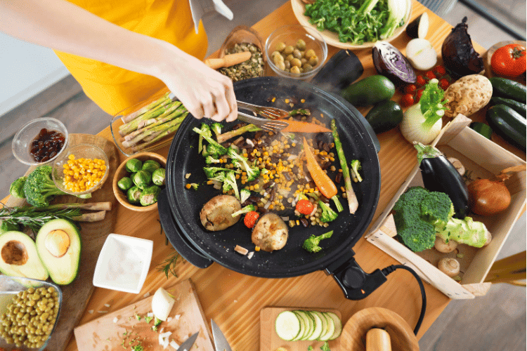 Top view of a woman preparing healthy vegan meal A woman preparing a vegan stir fry
