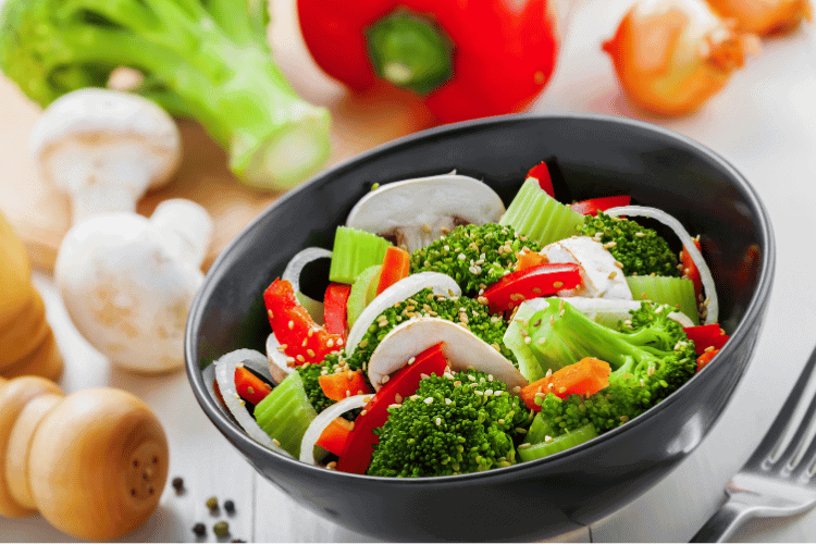 international healthy vegetarian salad in a grey bowl international healthy vegetarian salad in a grey bowl, closeup